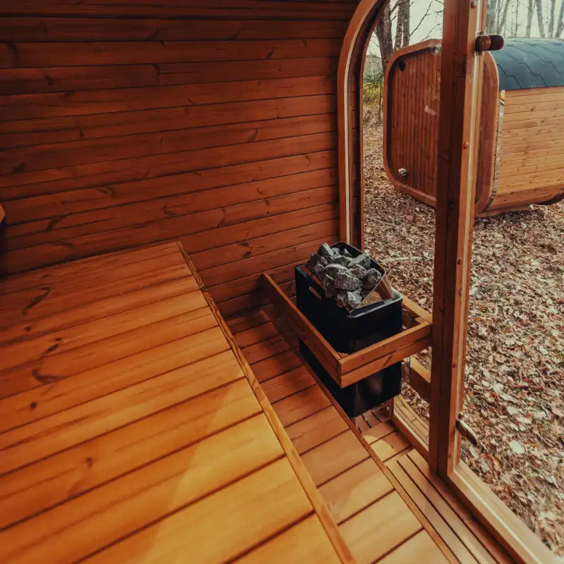 Exterior view of the Mande Spa USA sauna with electric heater through tempered glass doors and windows, creating a relaxing spa atmosphere.