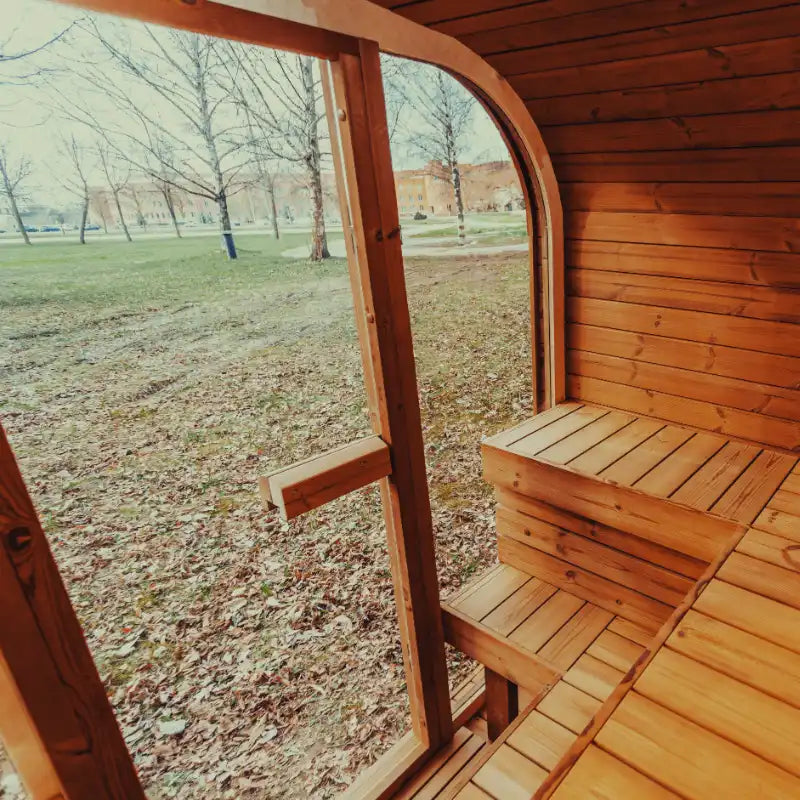 Exterior view of the Mande Spa USA sauna through tempered glass doors and windows, creating a relaxing spa atmosphere.