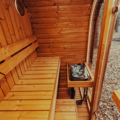 Fully assembled Mande Spa USA MW12 outdoor sauna with electric heater, showcasing a warm wooden interior design.