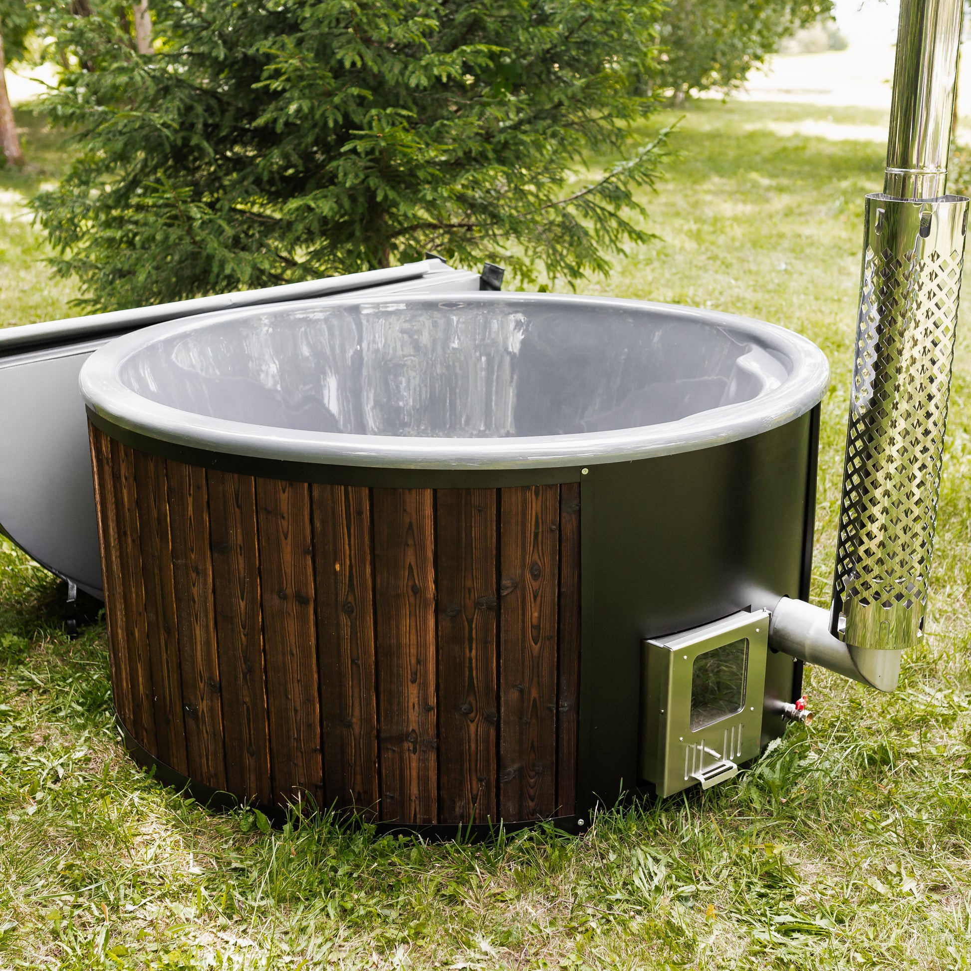 A wood-burning backyard hot tub for outdoor wellness, relaxation, and home spa use