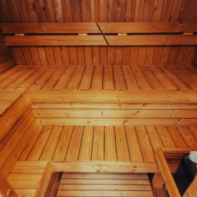 Mande Spa USA MW16 sauna interior with benches and warm lighting, creating a relaxing home spa atmosphere.