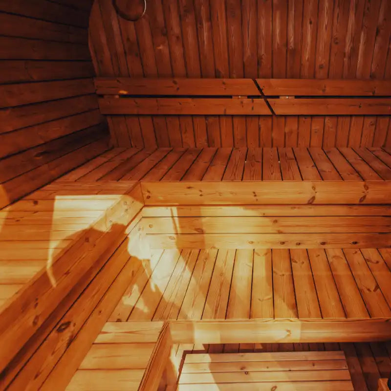 Mande Spa USA MW20  sauna interior with benches and warm lighting, creating a relaxing home spa atmosphere.