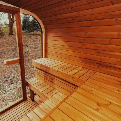 Mande Spa USA MW20 wooden interior of a sauna with a bench and open door showing a natural outdoor setting.