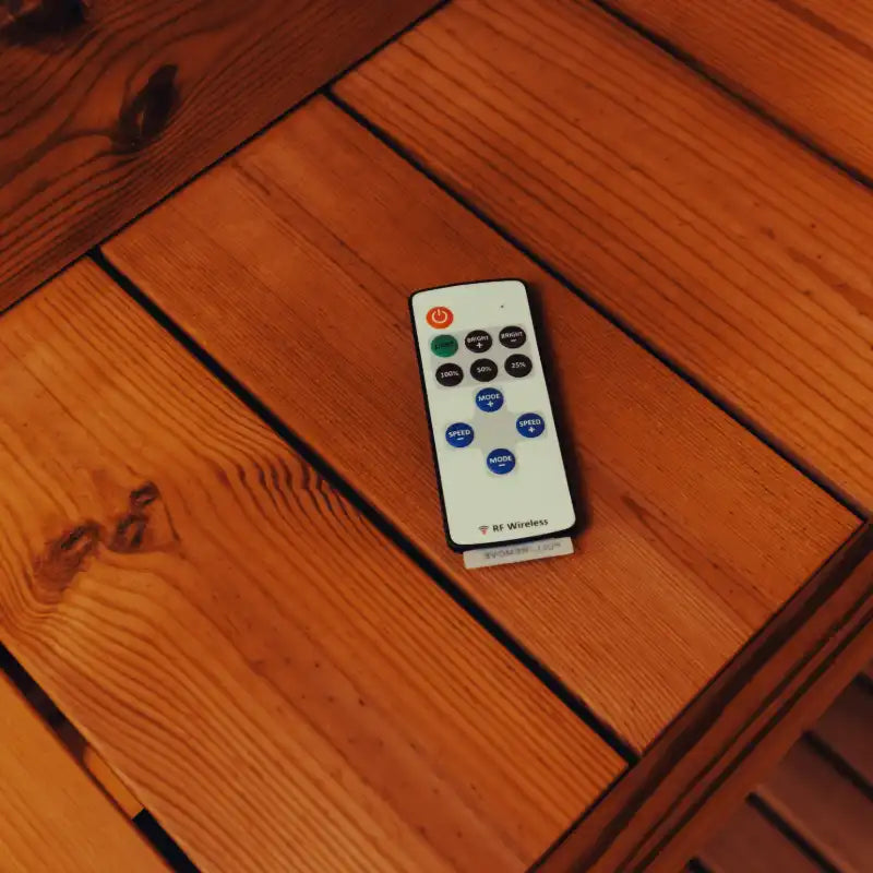 Wireless control panel for an electric sauna heater inside a Mande Spa USA sauna, showing convenient temperature control for home wellness use.